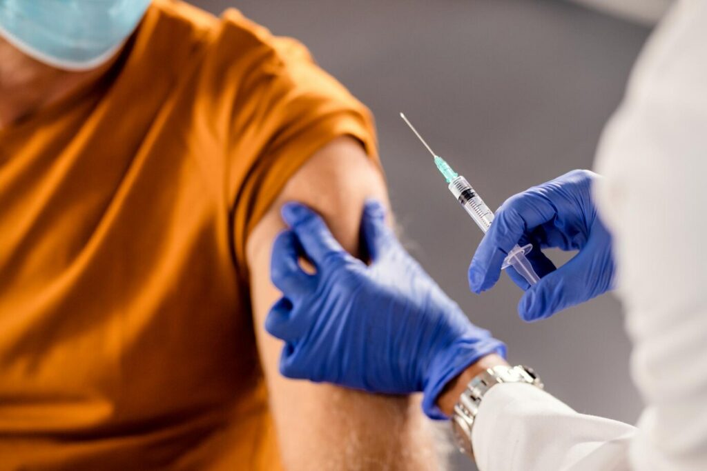 closeup healthcare worker giving vaccine senior patient 637285 11324